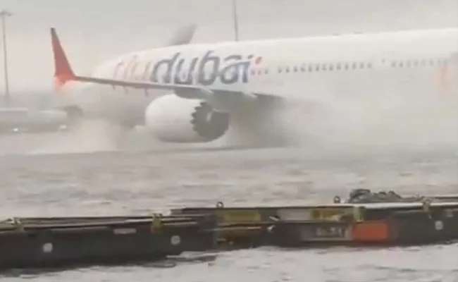 Dubai Floods: 28 Indian flights cancelled after heavy rains - Sakshi