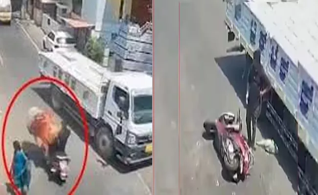 Bull Pounces On Scooter In BengaluruTrucker driver Saves Rider - Sakshi