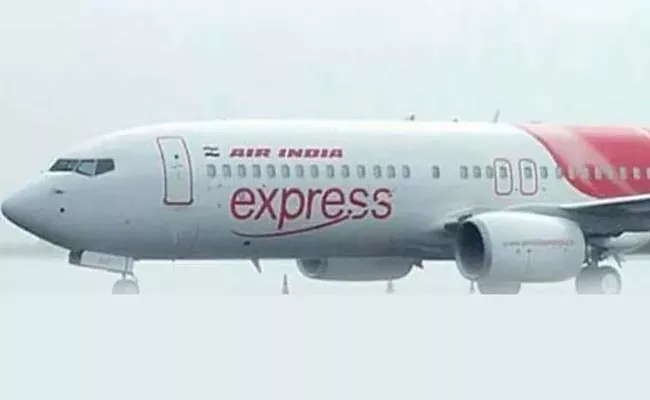 Air India Express Flight diverted to Muscat after burning smell - Sakshi