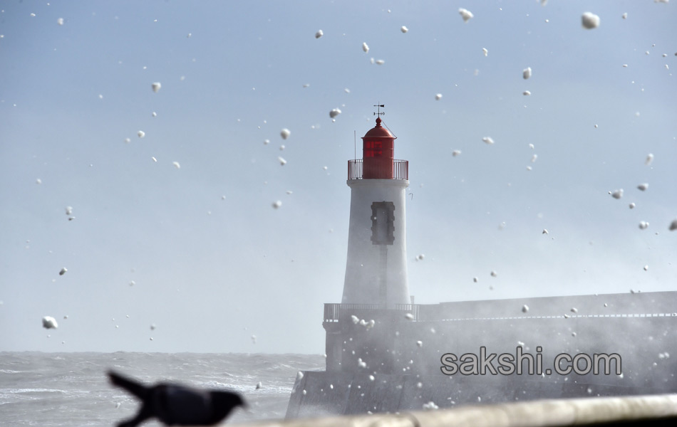 Waves crash near the Port15