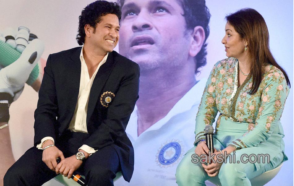 Sachin Tendulkar presents a copy of his autobiography10