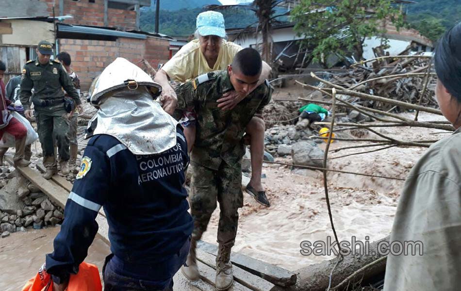 Colombia shaken after surging rivers avalanche leaves14