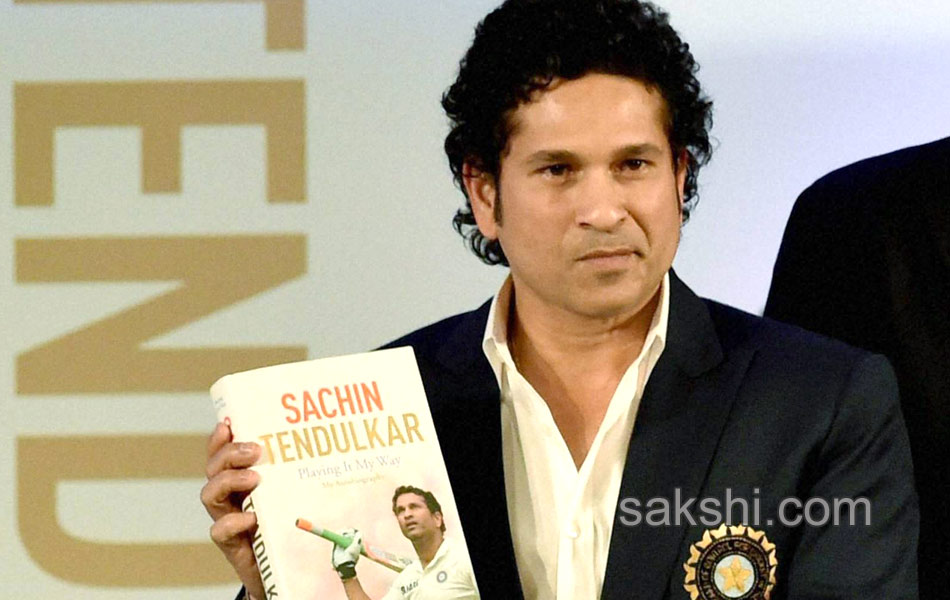 Sachin Tendulkar presents a copy of his autobiography7