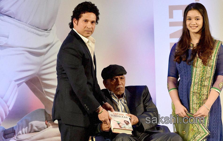 Sachin Tendulkar presents a copy of his autobiography9