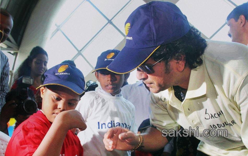 Sachin Tendulkar with under privileged during an event2