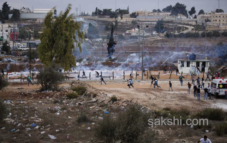 Palestinian demonstrators during clashes in the West Bank8