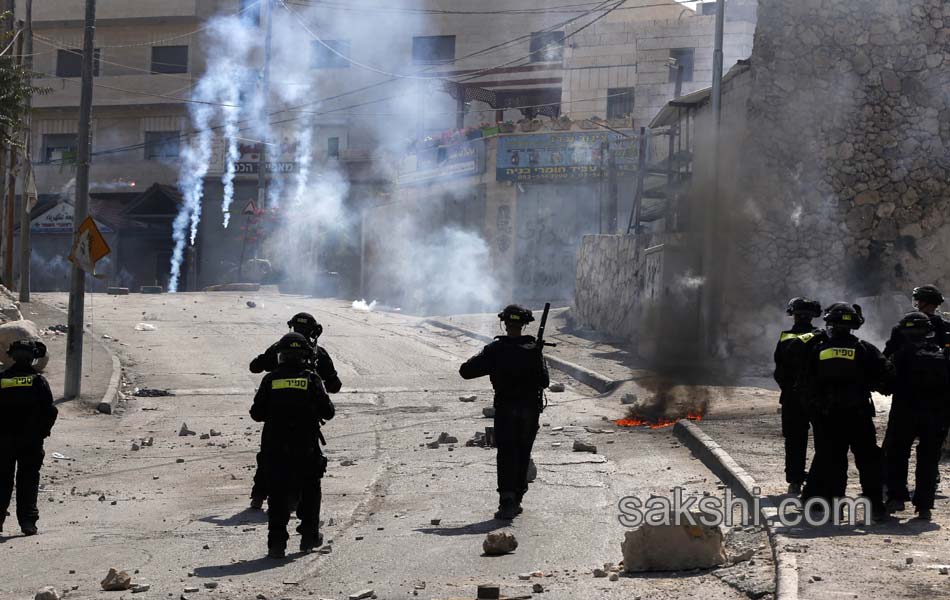 Palestinian demonstrators during clashes in the West Bank14