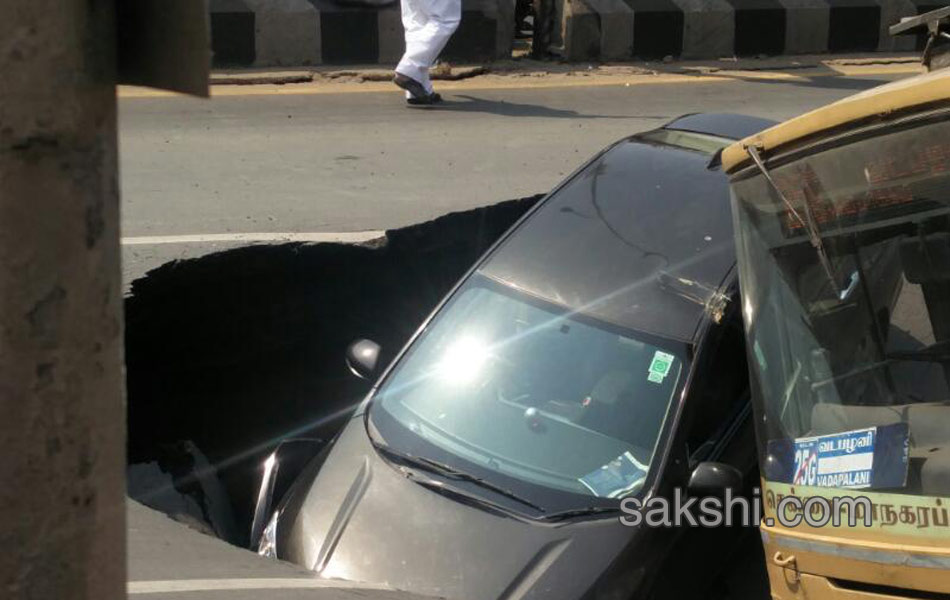 Huge cave in on popular Mount Road in Chennai swallows bus and car - Sakshi13