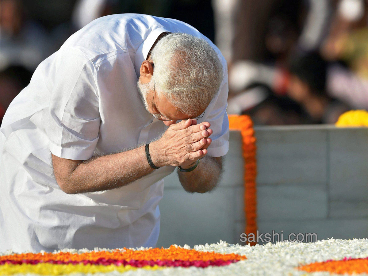 148th birth anniversary at Rajghat in New Delhi  - Sakshi9