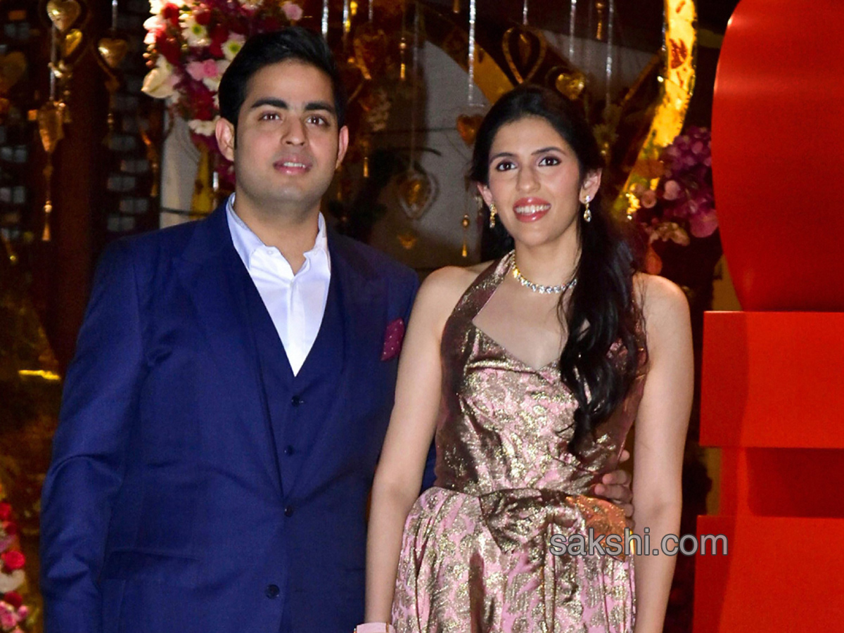 Akash Ambani with fiancee Shloka Mehta during their engagement party - Sakshi3