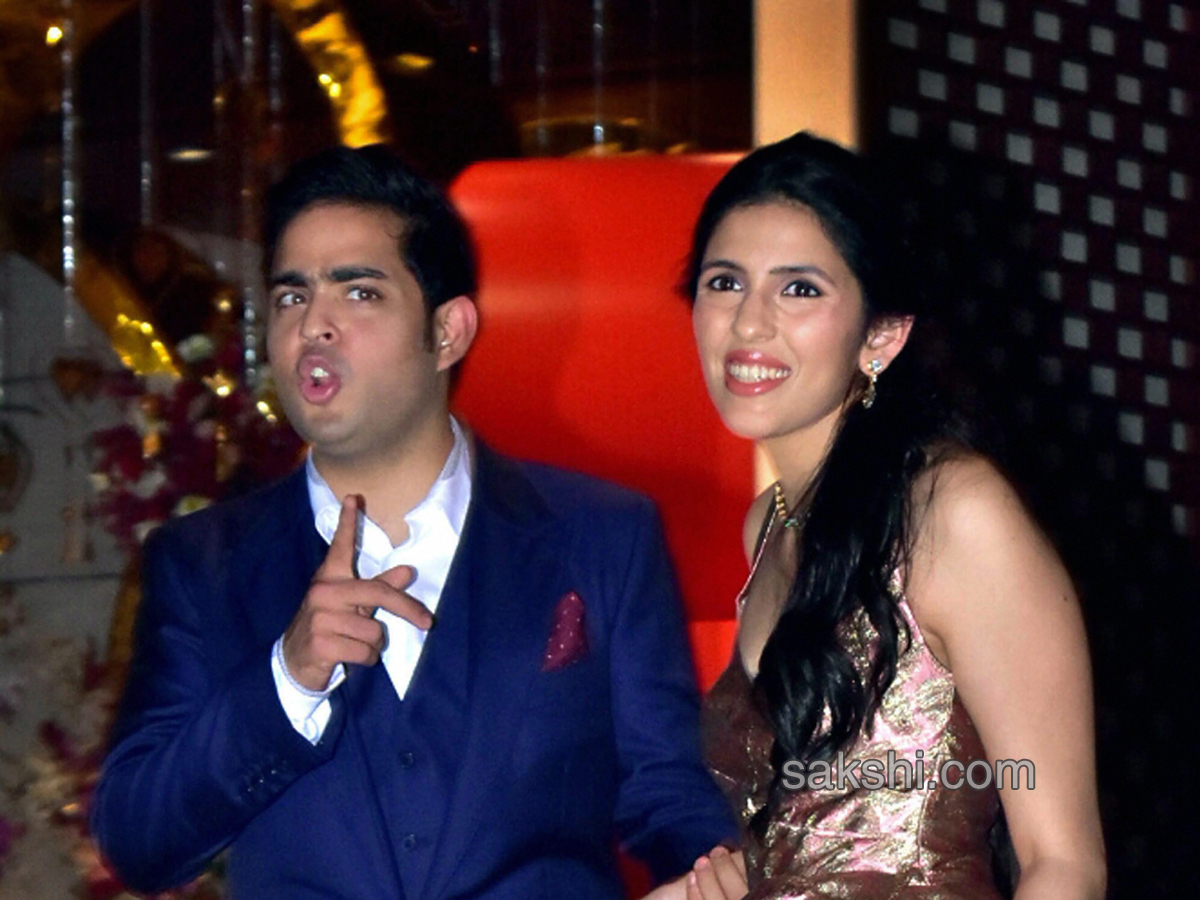 Akash Ambani with fiancee Shloka Mehta during their engagement party - Sakshi5