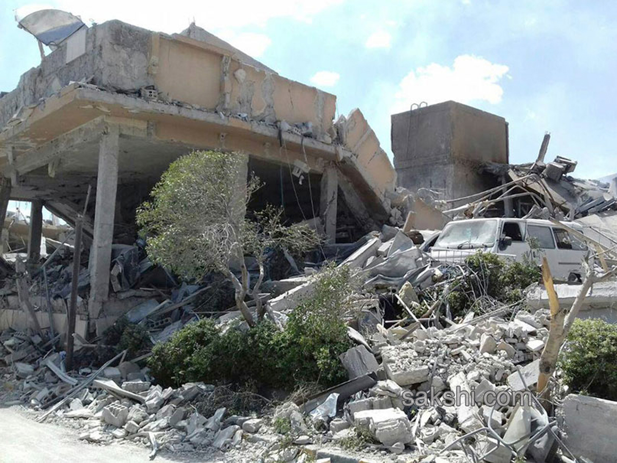 Shocking Pictures Show Aftermath of Air Strikes in Syria - Sakshi2