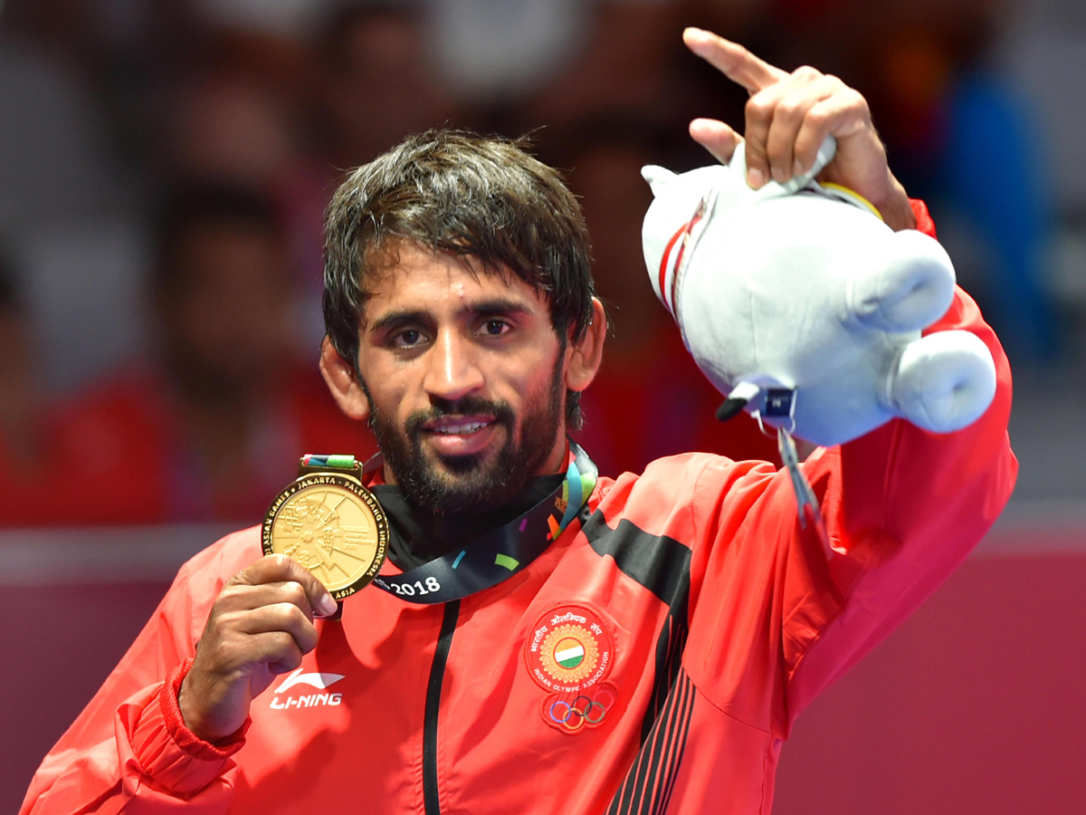 Indian Wrestler Bajrang Punia Wins Gold at Asian Games 2018 - Sakshi1