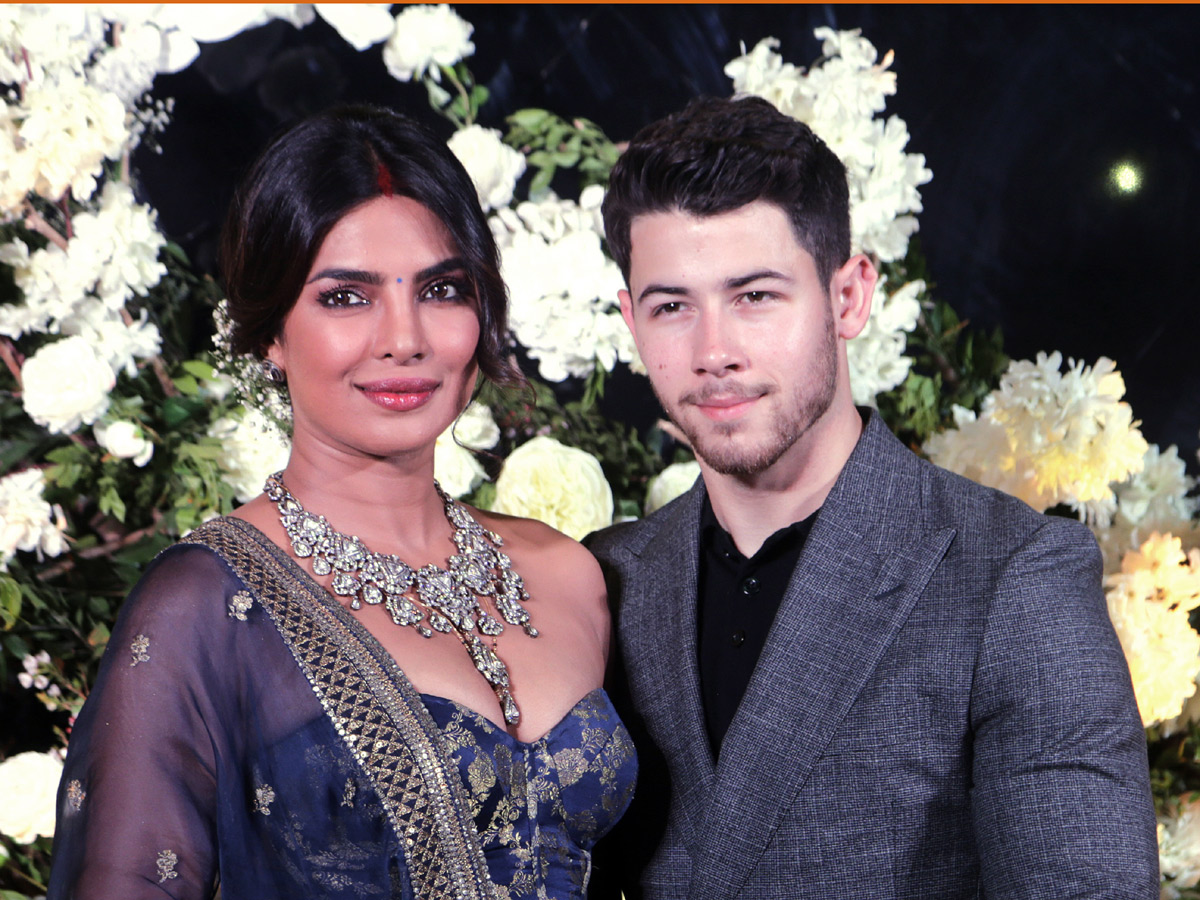 Priyanka Chopra and Nick Jonas pose wedding reception in Mumbai - Sakshi1