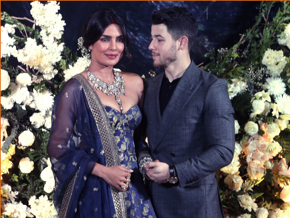 Priyanka Chopra and Nick Jonas pose wedding reception in Mumbai - Sakshi11