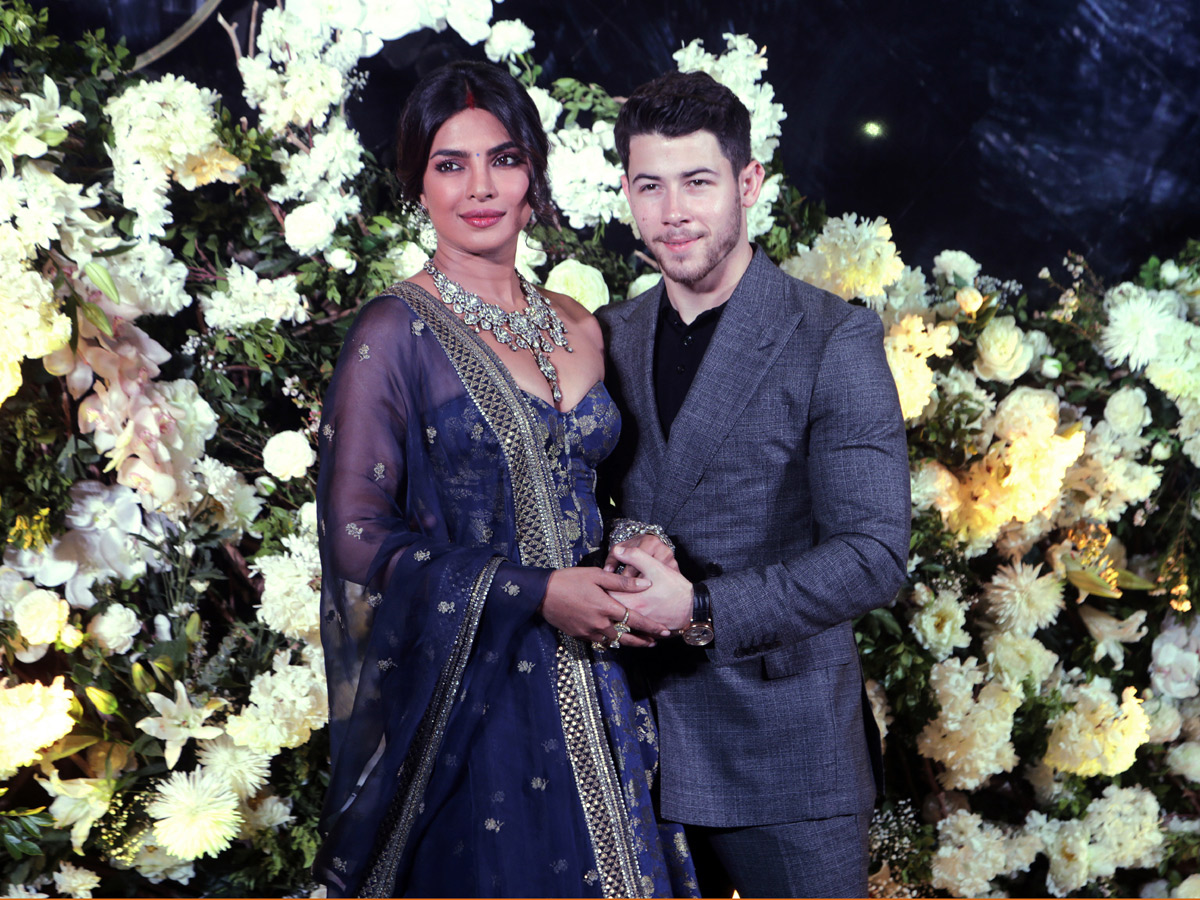 Priyanka Chopra and Nick Jonas pose wedding reception in Mumbai - Sakshi2