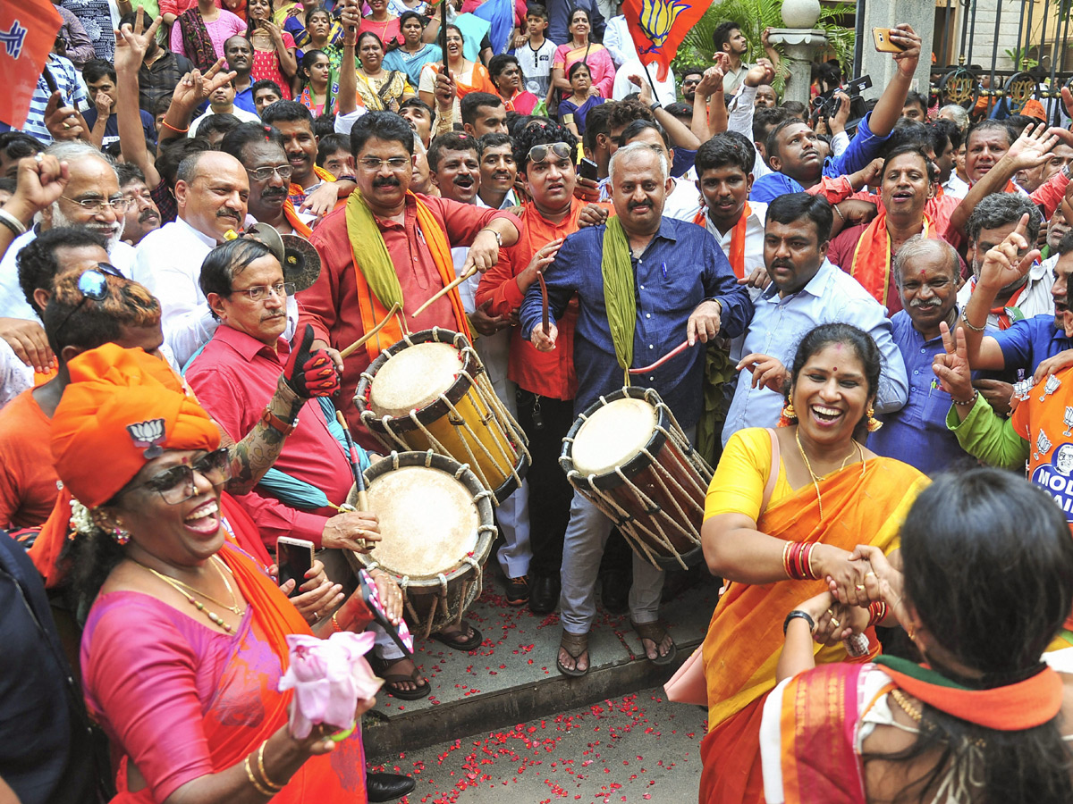 BJP supporters celebrate after trends indicate clean sweep  for NDA - Sakshi11