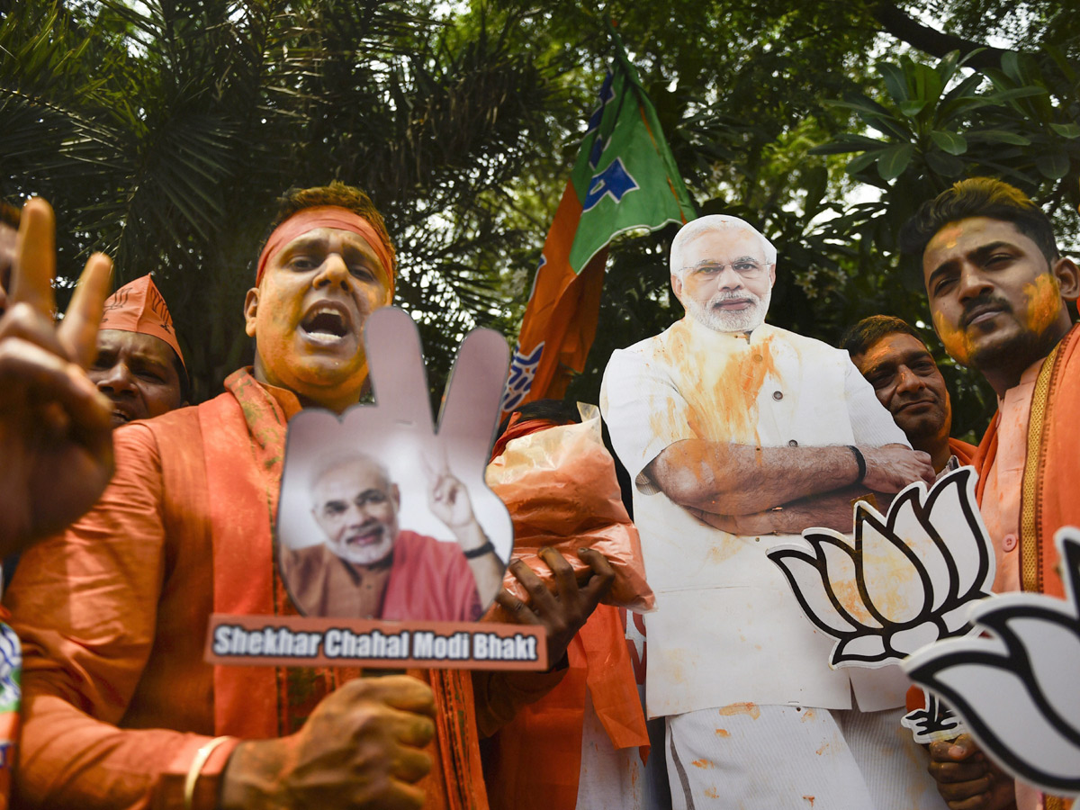 BJP supporters celebrate after trends indicate clean sweep  for NDA - Sakshi18