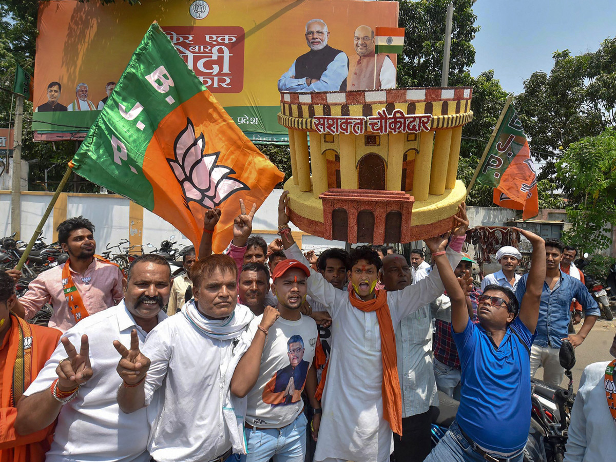 BJP supporters celebrate after trends indicate clean sweep  for NDA - Sakshi19