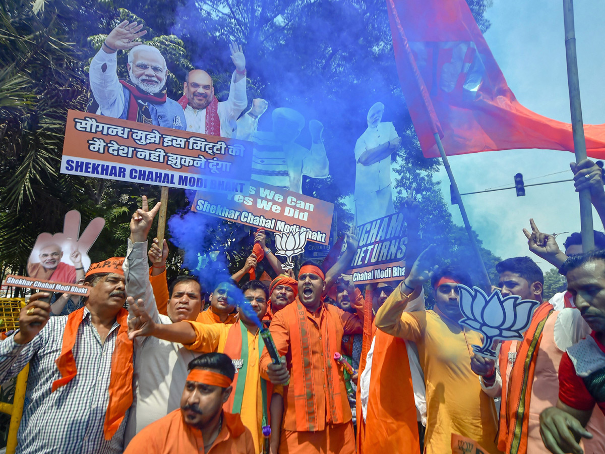 BJP supporters celebrate after trends indicate clean sweep  for NDA - Sakshi25