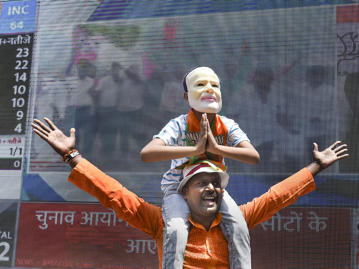 BJP supporters celebrate after trends indicate clean sweep  for NDA - Sakshi29