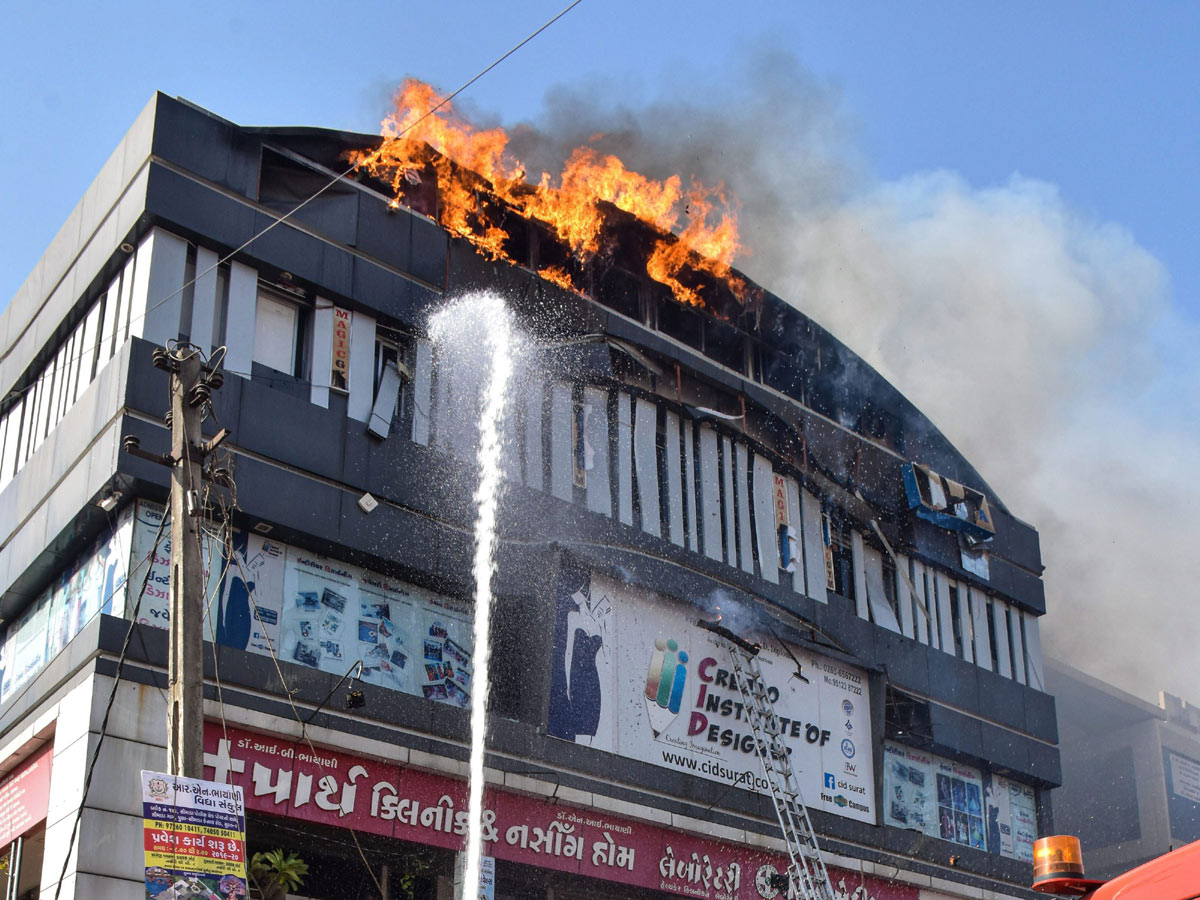 Fire Accident Taxshila Complex in Surat Photo Gallery - Sakshi16