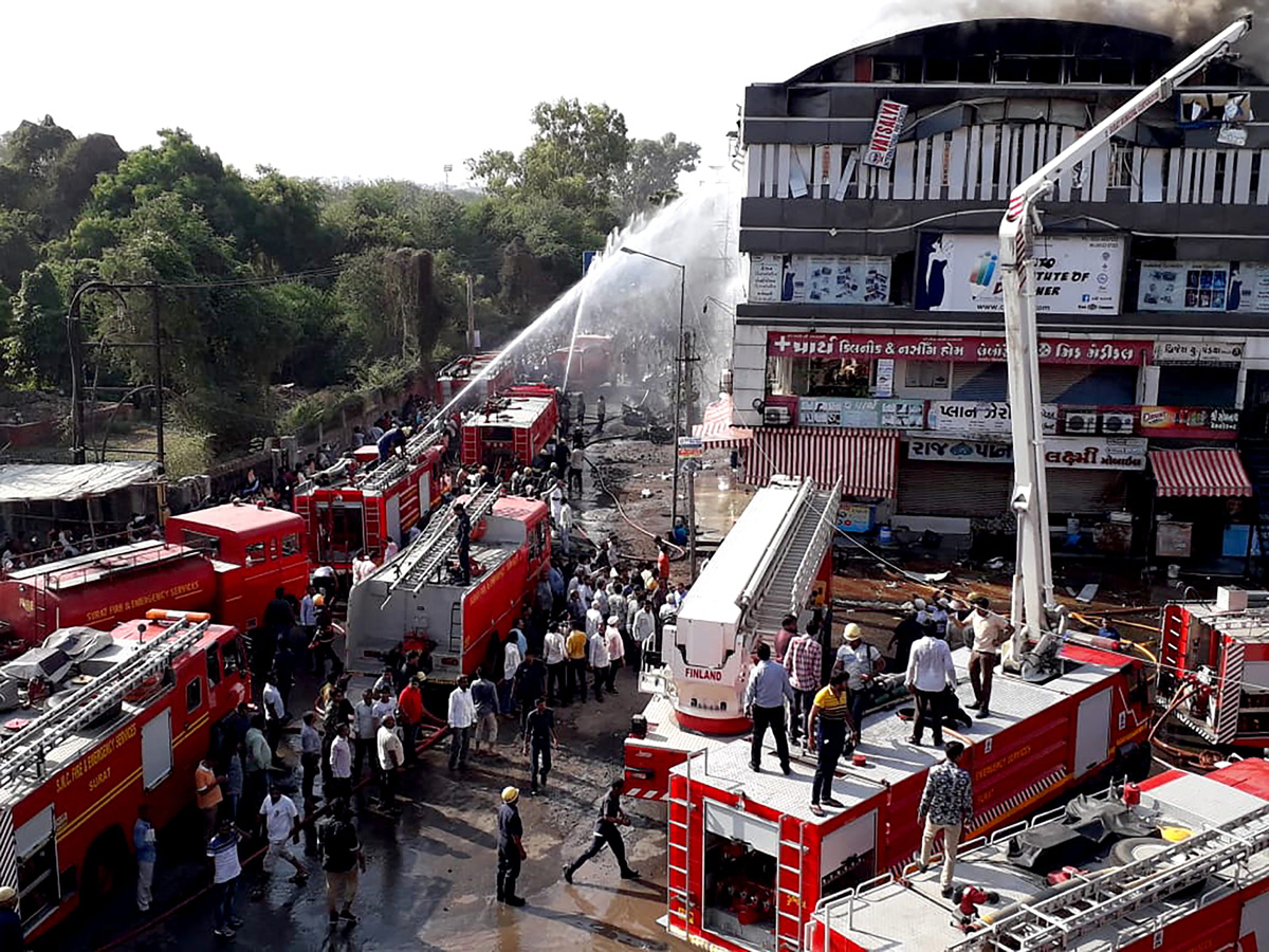 Fire Accident Taxshila Complex in Surat Photo Gallery - Sakshi5