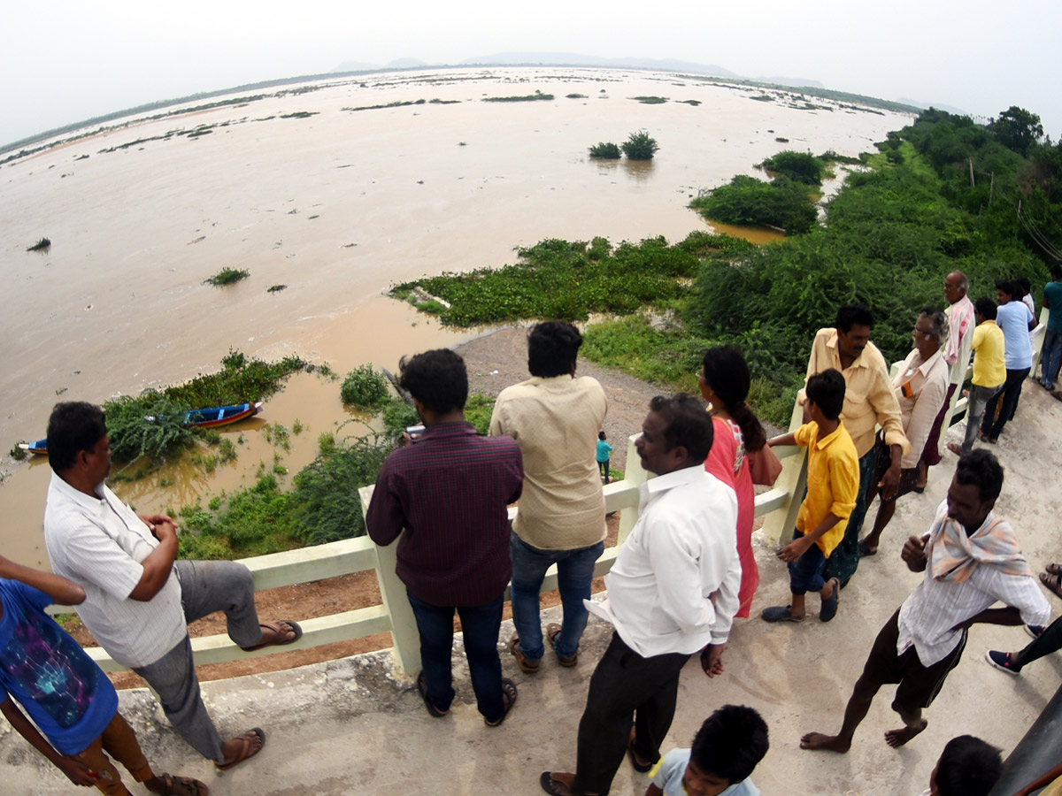 Record Level Flood Water Reaches Prakasam Barrage Photo Gallery - Sakshi11