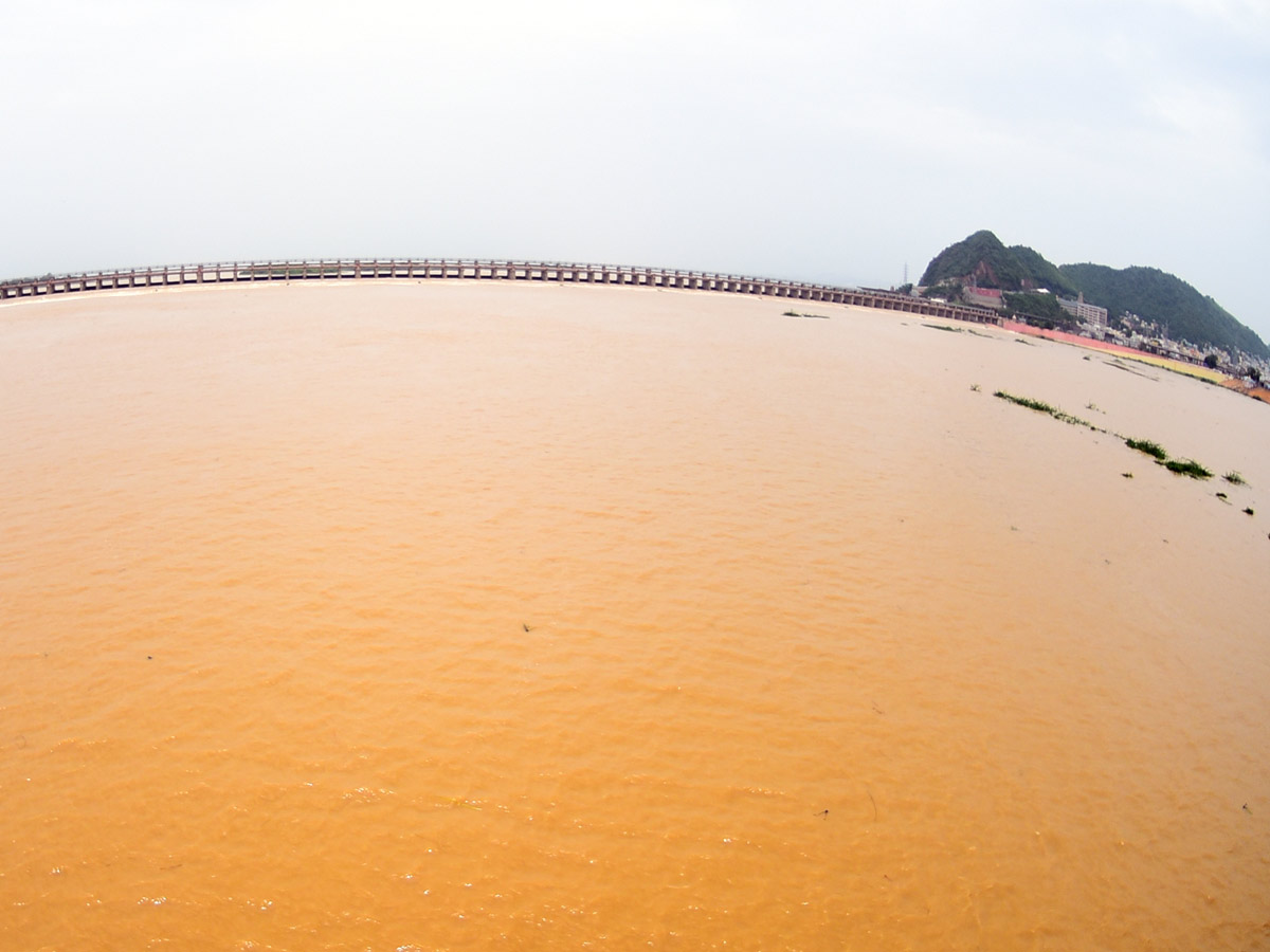 Record Level Flood Water Reaches Prakasam Barrage Photo Gallery - Sakshi15