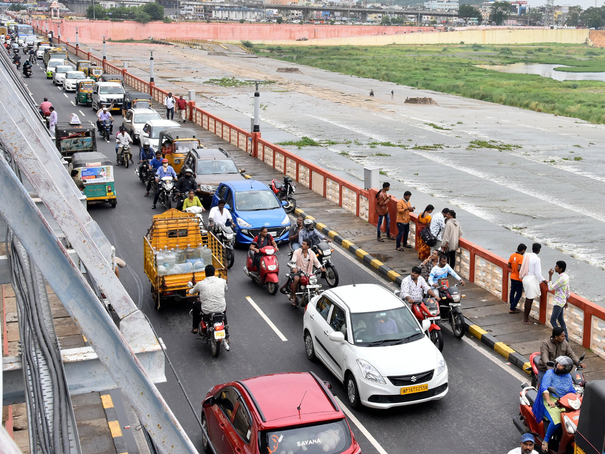 Record Level Flood Water Reaches Prakasam Barrage Photo Gallery - Sakshi16