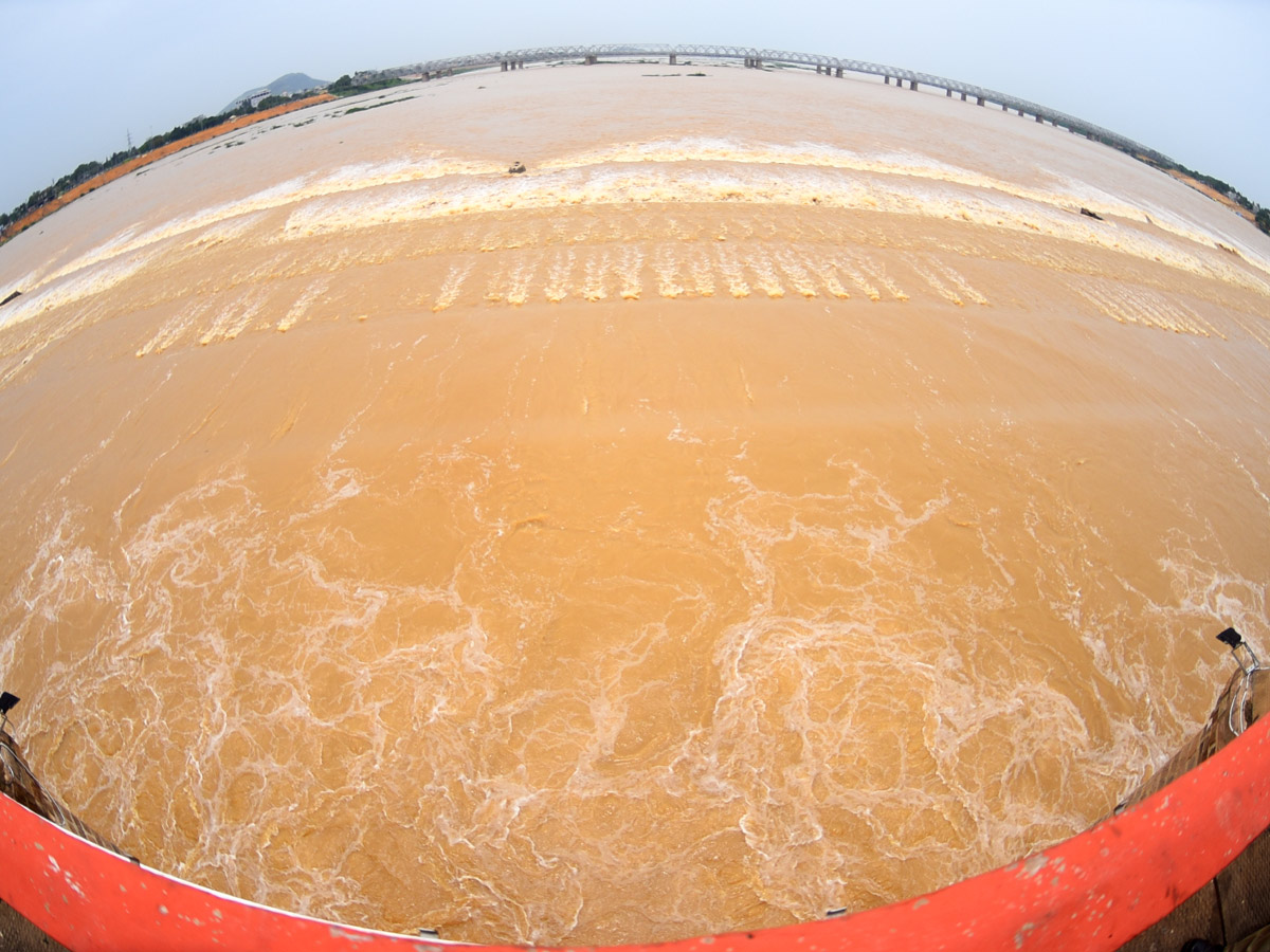 Record Level Flood Water Reaches Prakasam Barrage Photo Gallery - Sakshi19