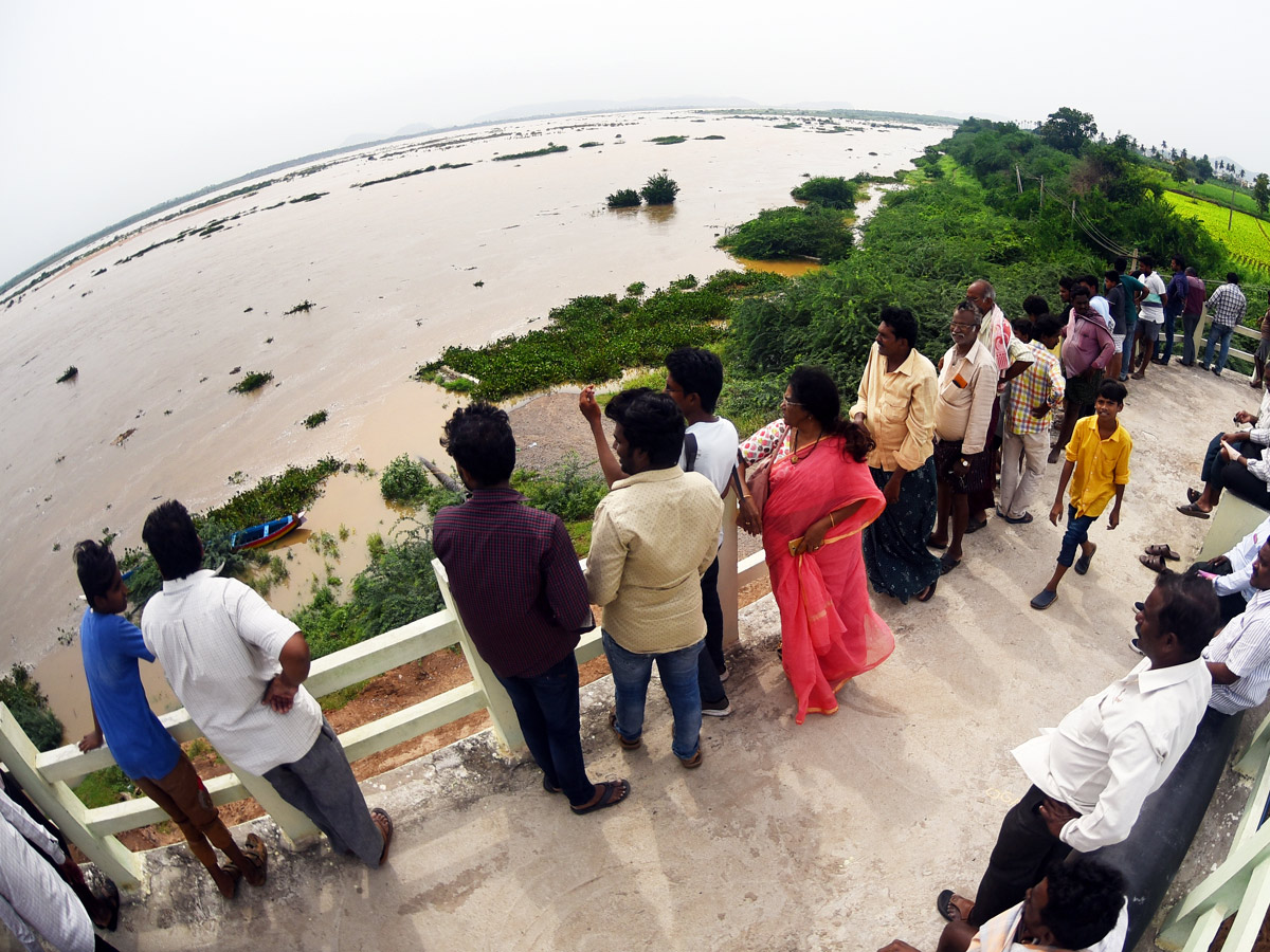 Record Level Flood Water Reaches Prakasam Barrage Photo Gallery - Sakshi20