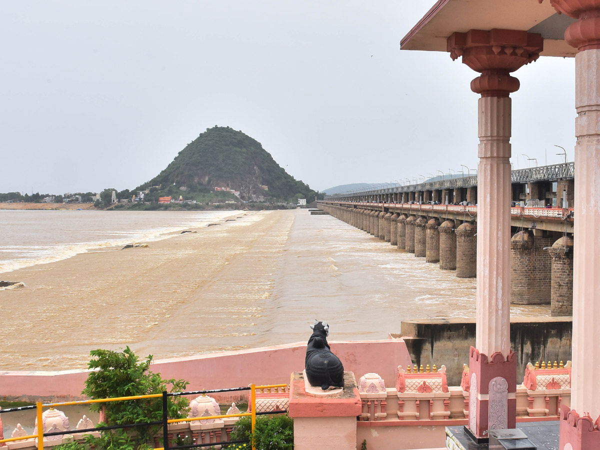 Record Level Flood Water Reaches Prakasam Barrage Photo Gallery - Sakshi5