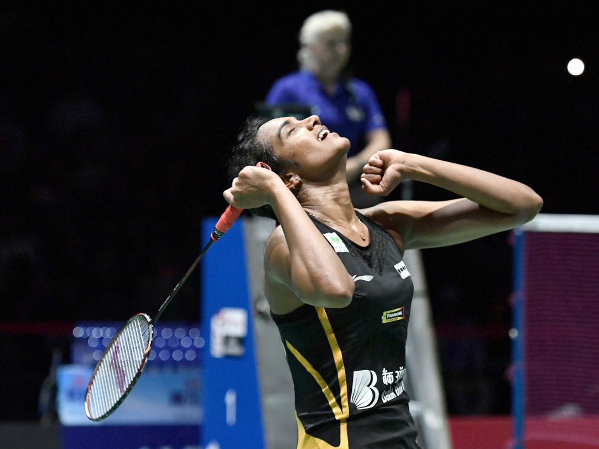 P V Sindhu Becomes First Indian To Clinch Badminton World Championships Gold - Sakshi1