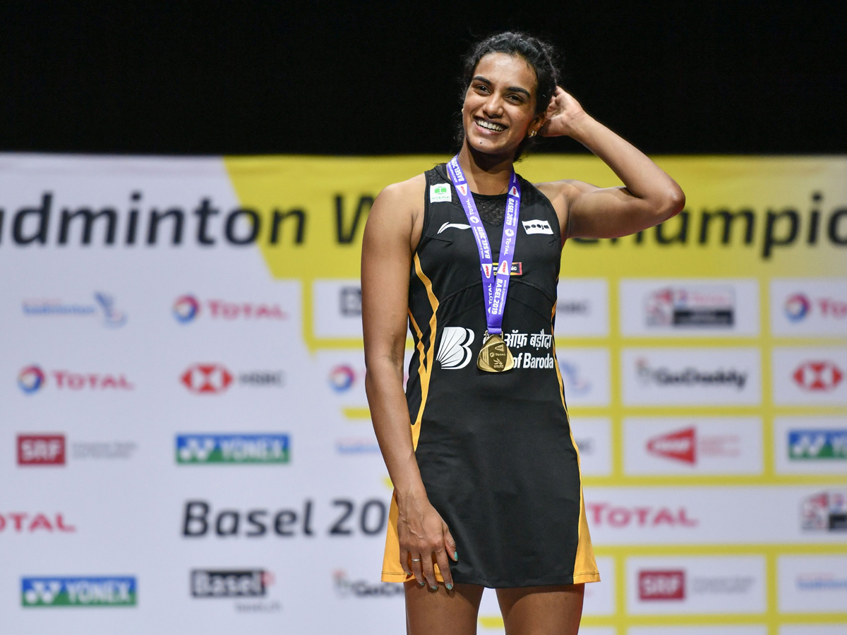 P V Sindhu Becomes First Indian To Clinch Badminton World Championships Gold - Sakshi12