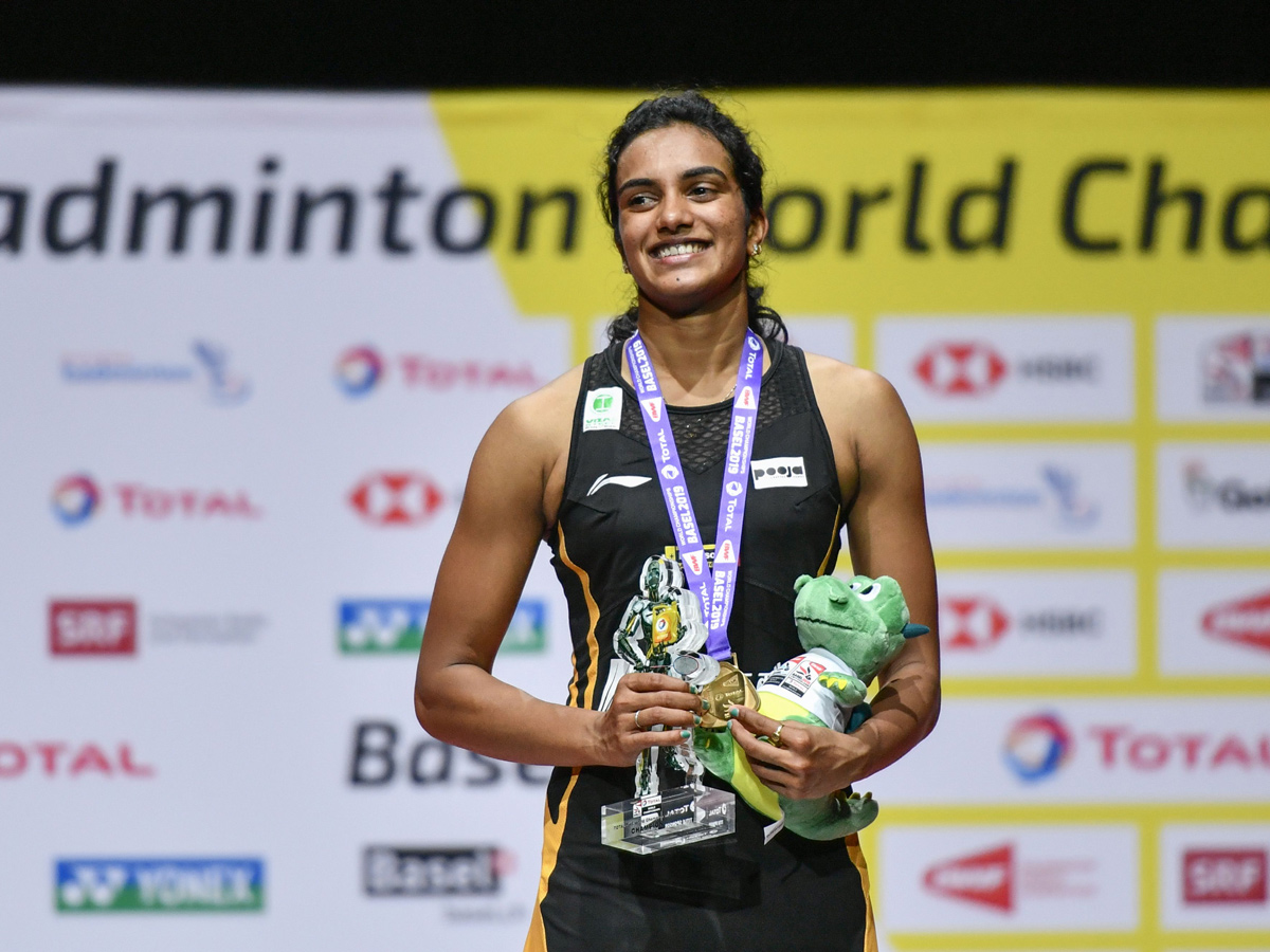 P V Sindhu Becomes First Indian To Clinch Badminton World Championships Gold - Sakshi13