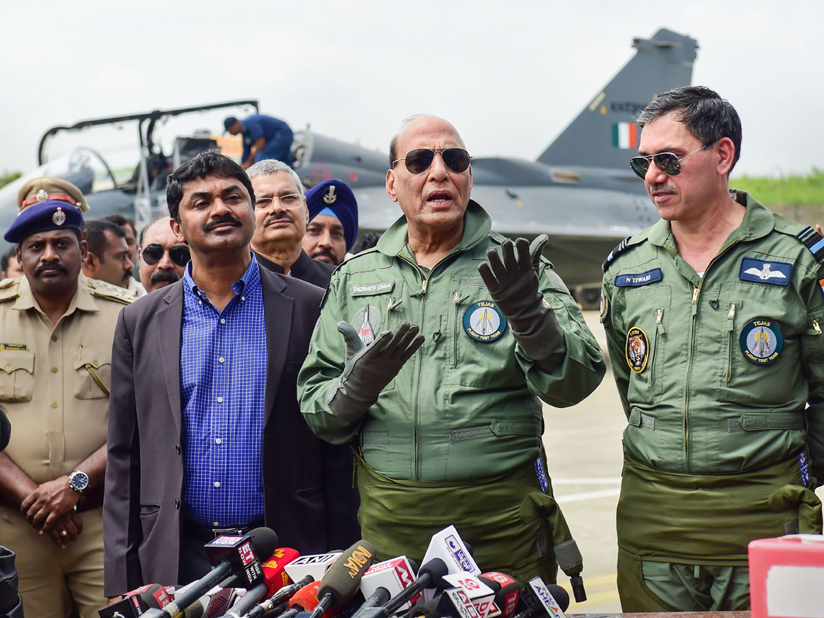 Rajnath Singh becomes fly in light combat aircraft Tejas Photo Gallery - Sakshi15