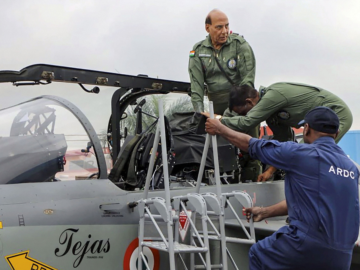 Rajnath Singh becomes fly in light combat aircraft Tejas Photo Gallery - Sakshi3