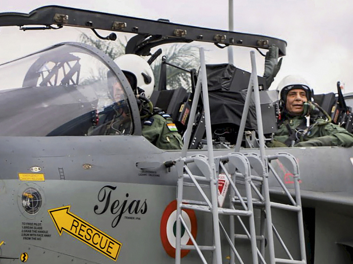 Rajnath Singh becomes fly in light combat aircraft Tejas Photo Gallery - Sakshi4