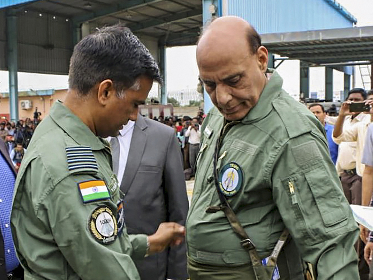 Rajnath Singh becomes fly in light combat aircraft Tejas Photo Gallery - Sakshi5