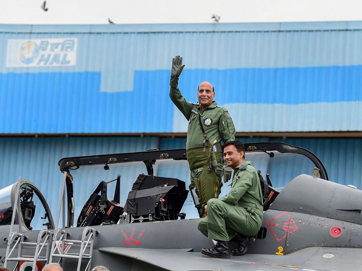 Rajnath Singh becomes fly in light combat aircraft Tejas Photo Gallery - Sakshi7