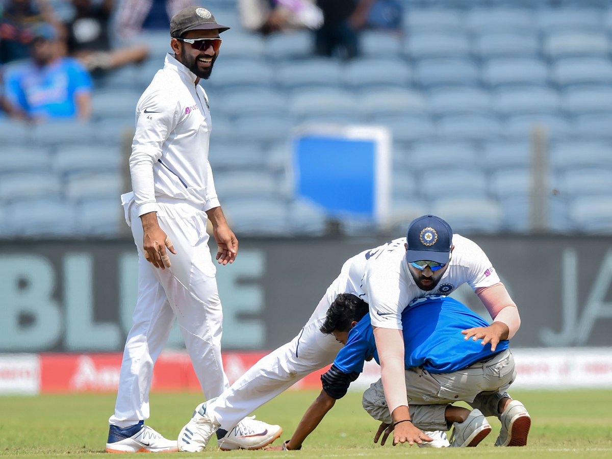 Fan Who Ran Towards The Meet Indian Batsman Rohit Sharma - Sakshi1