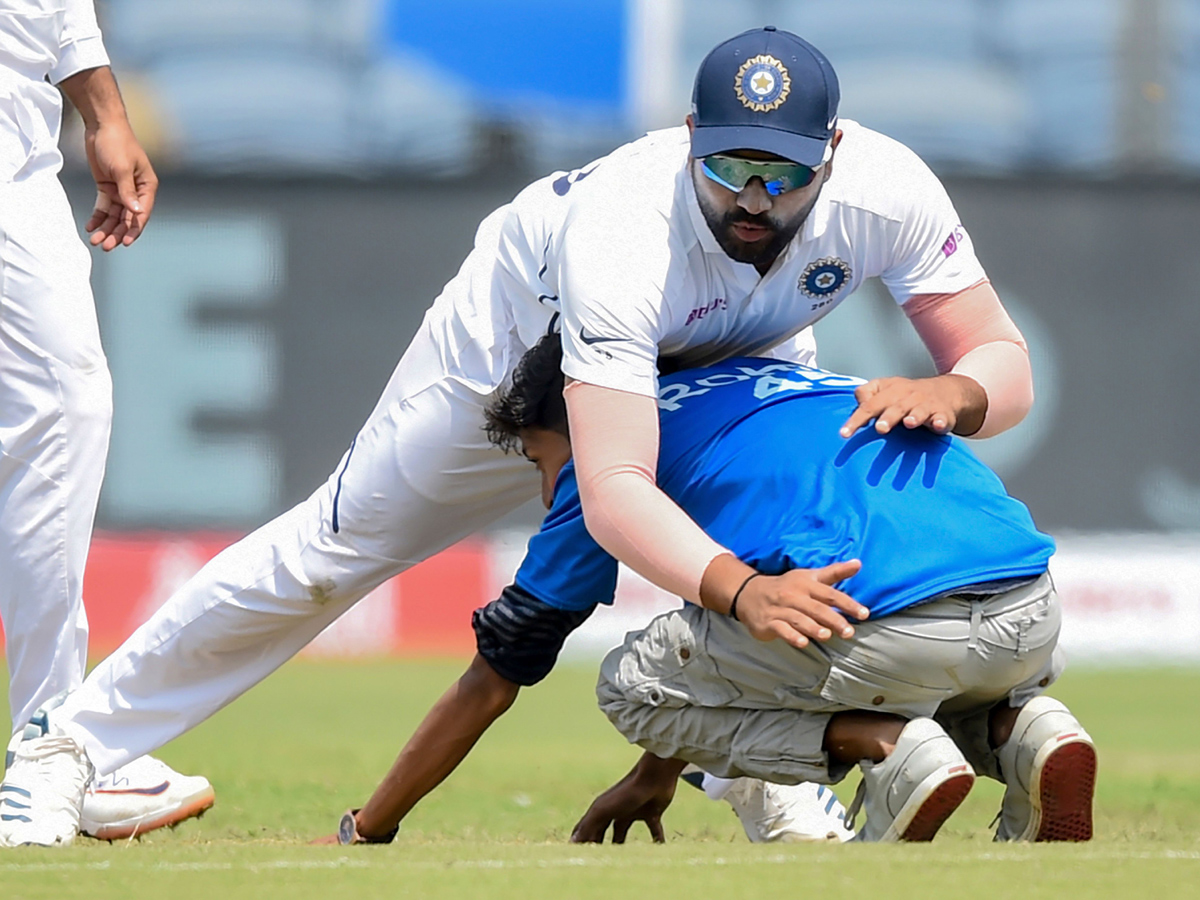 Fan Who Ran Towards The Meet Indian Batsman Rohit Sharma - Sakshi2