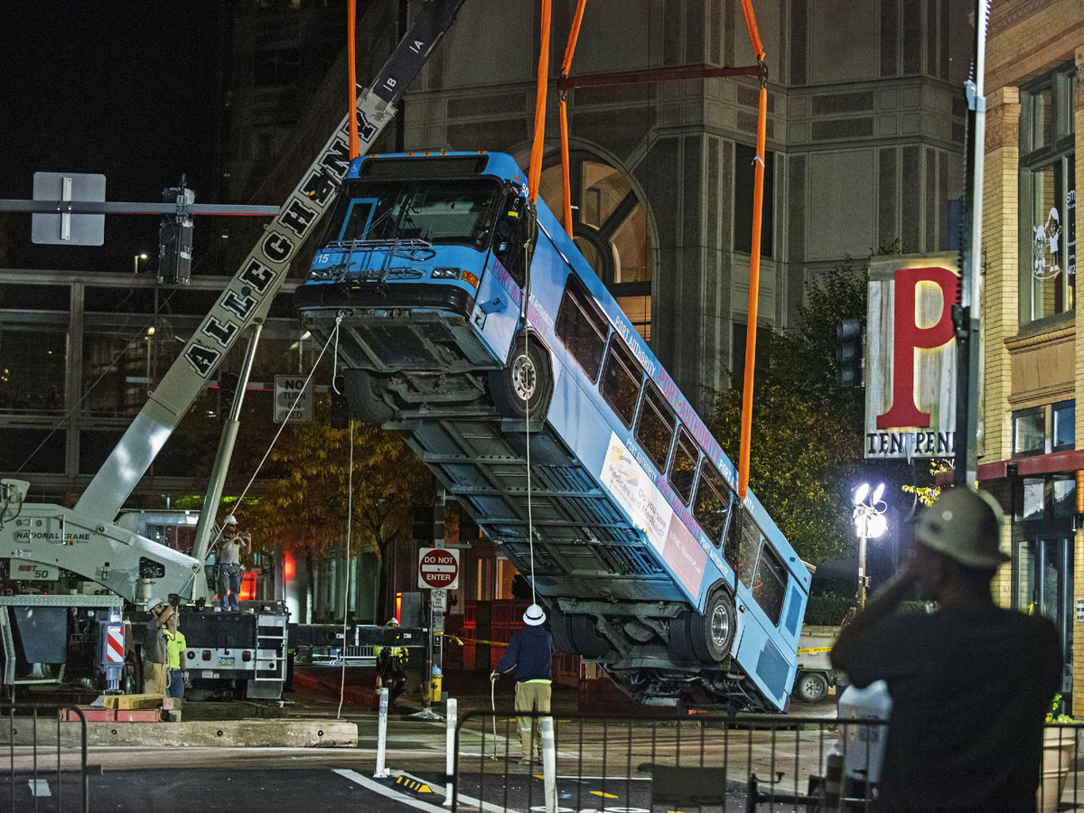 Cranes Remove Bus Partially Swallowed by Pittsburgh Sinkhole - Sakshi4