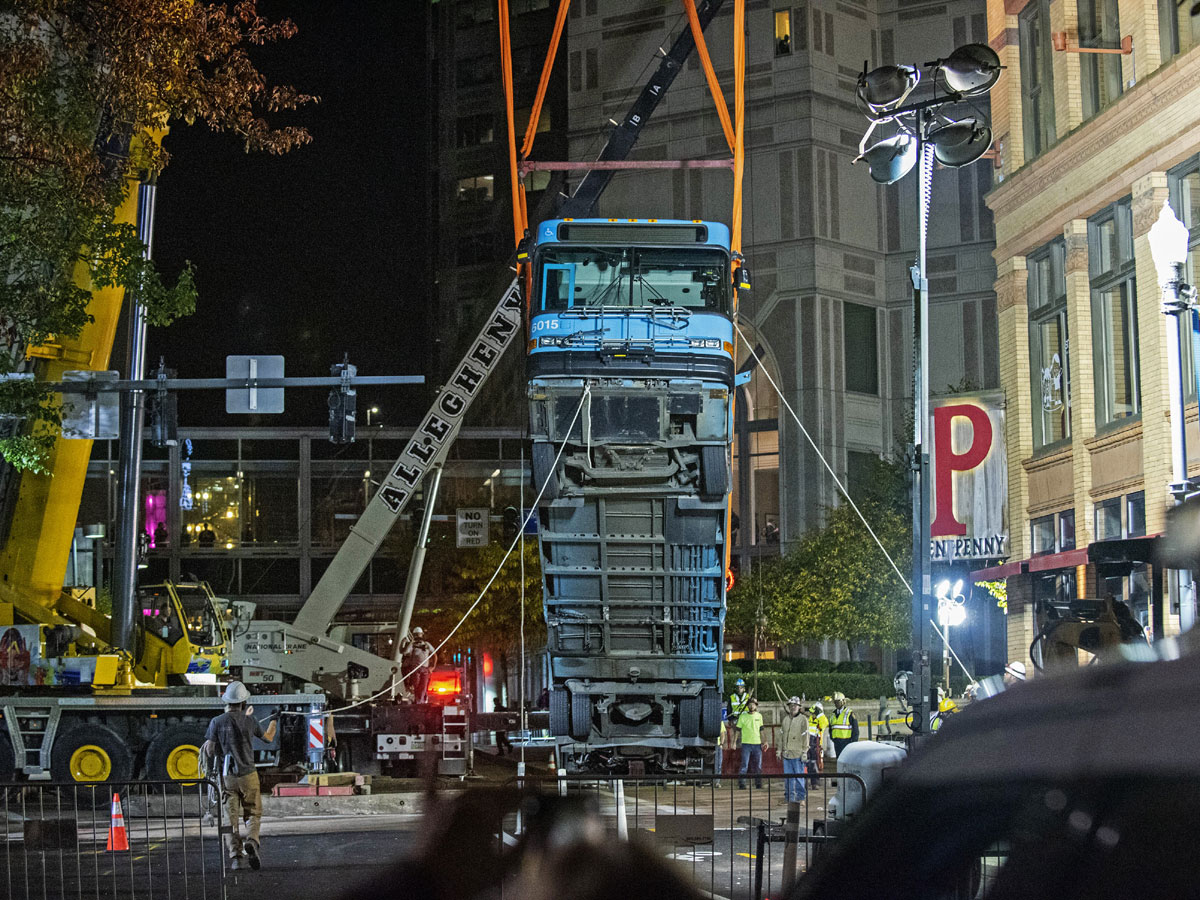 Cranes Remove Bus Partially Swallowed by Pittsburgh Sinkhole - Sakshi5