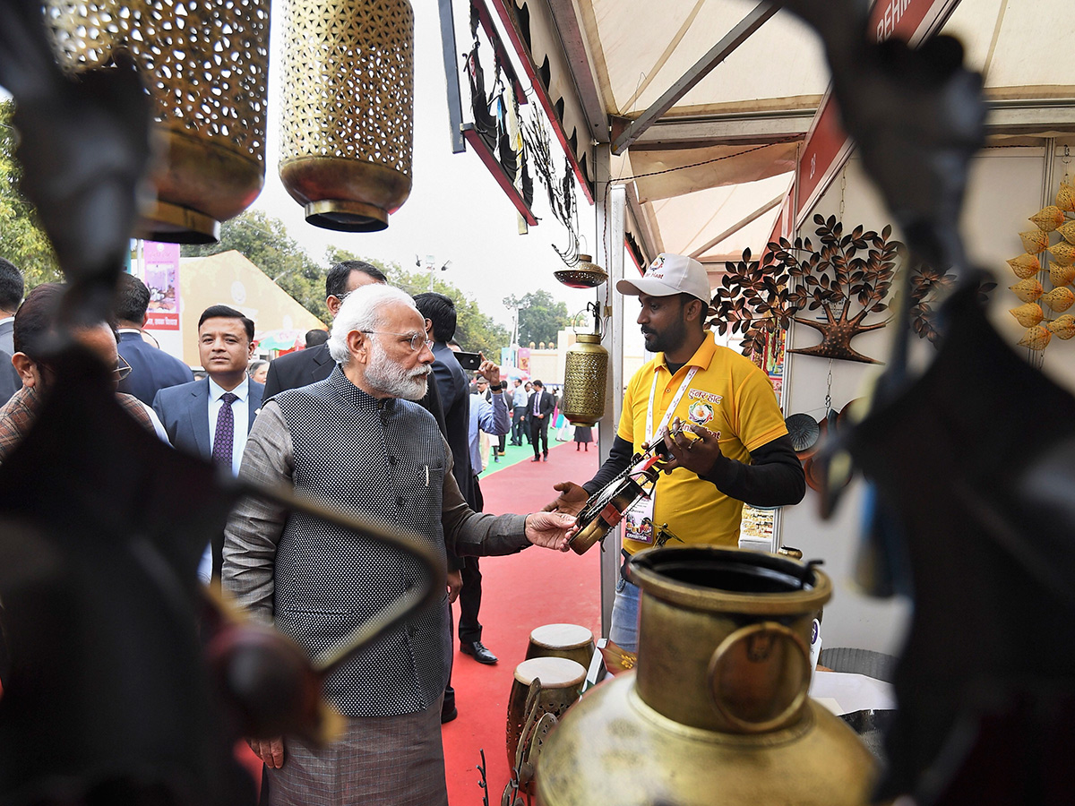 PM Narendra Modi Visits Artisans Fair Hunar Haat in New Delhi Photo Gallery - Sakshi13