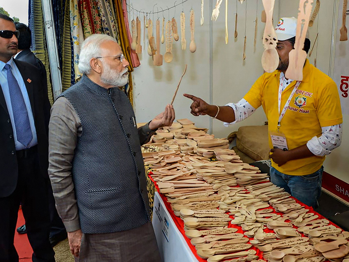 PM Narendra Modi Visits Artisans Fair Hunar Haat in New Delhi Photo Gallery - Sakshi4