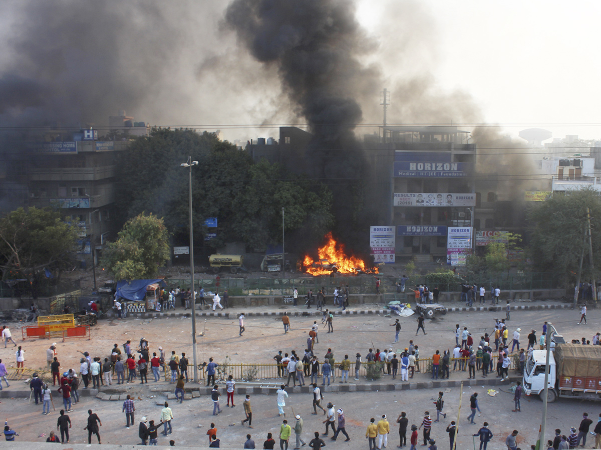  Delhi rocked by deadly protests during Donald Trump India visit Photo Gallery - Sakshi1