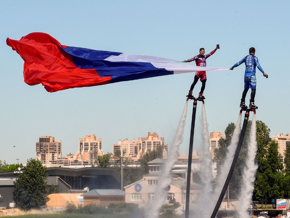 Russian hydroflight team hold the Russian national flag during the Russia Day celebration Photo Gallery - Sakshi2