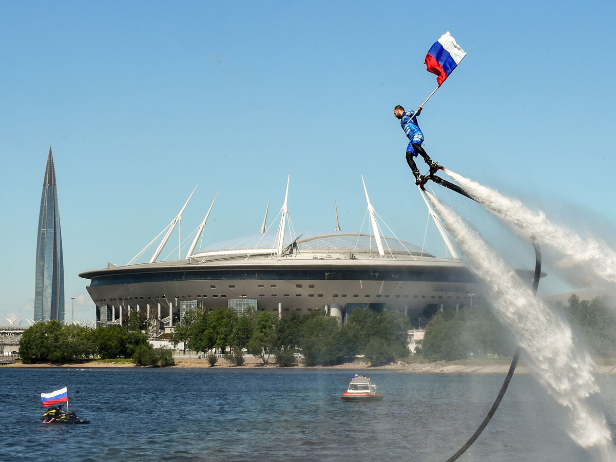 Russian hydroflight team hold the Russian national flag during the Russia Day celebration Photo Gallery - Sakshi3